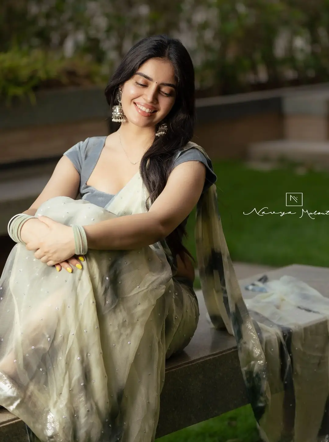 Navya Marouthu Wearing White Saree Sleeveless Black Blouse